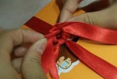 禮帶的結怎么打,包裝盒絲帶蝴蝶結的打法圖14